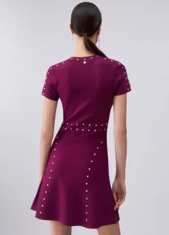 Abito in maglia con borchie