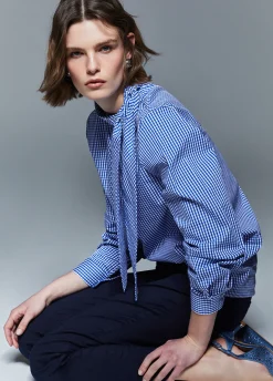 Blusa con maxi fiocco