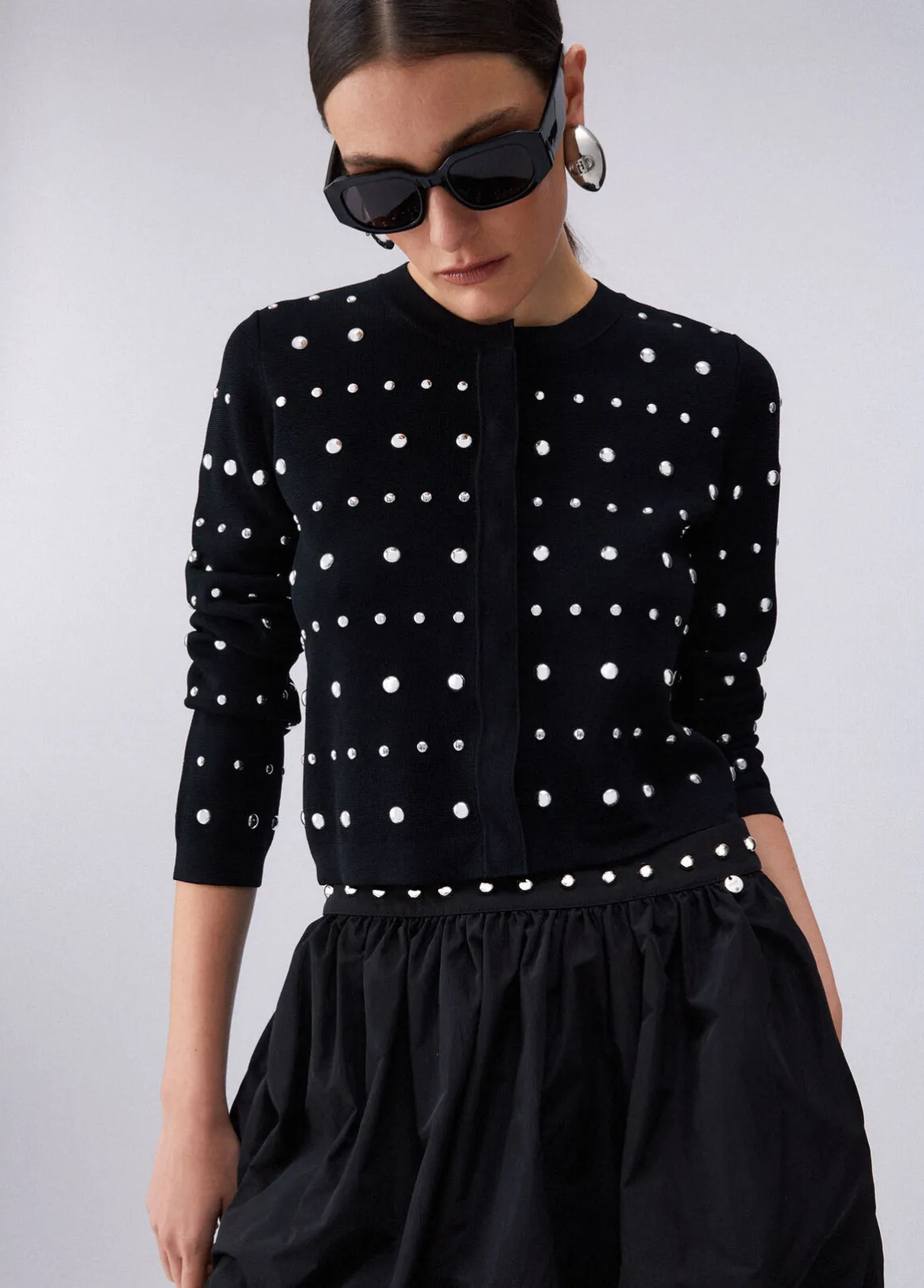 Cardigan con borchie