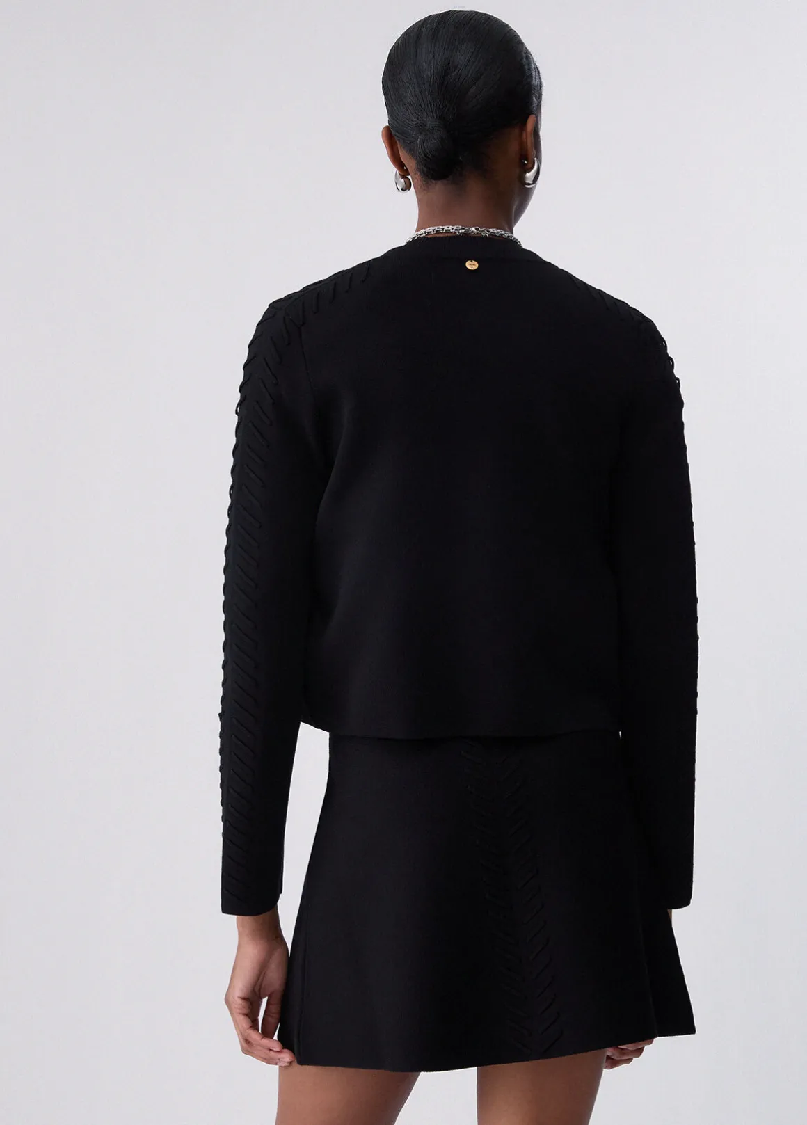 Cardigan con dettagli intrecciati