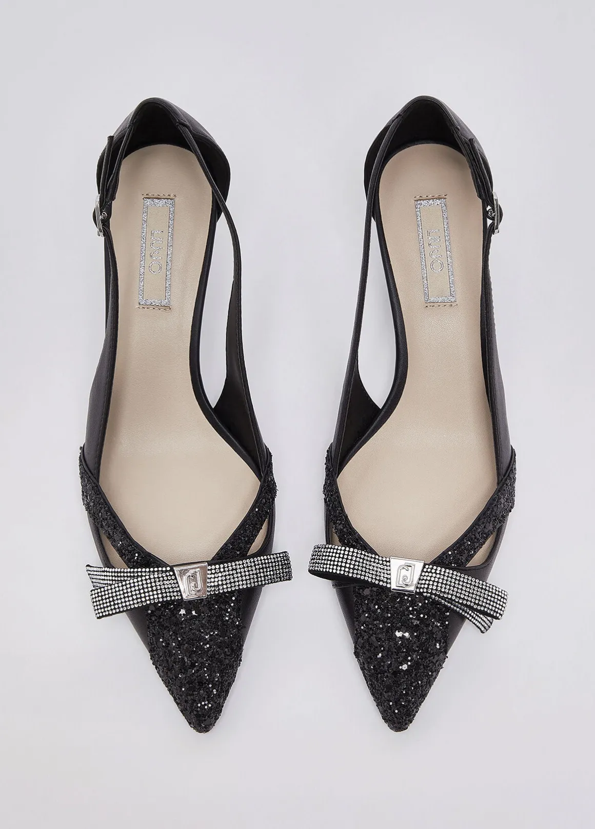 Décolleté glitter con cut-out