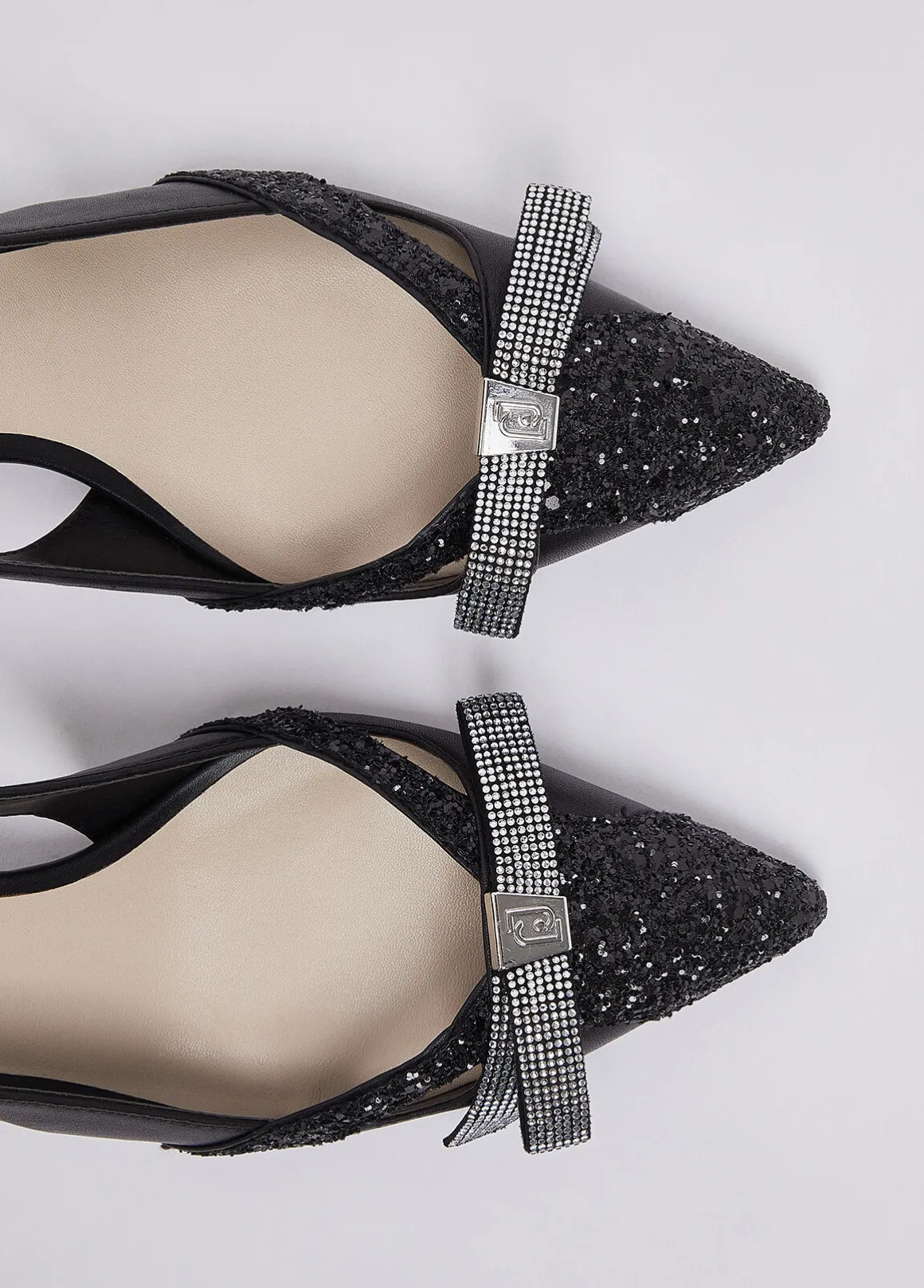 Décolleté glitter con cut-out