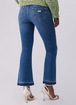 Jeans bootcut con orli unfinished