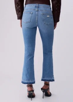 Jeans bootcut con orli unfinished