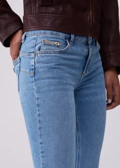 Jeans bootcut con orli unfinished