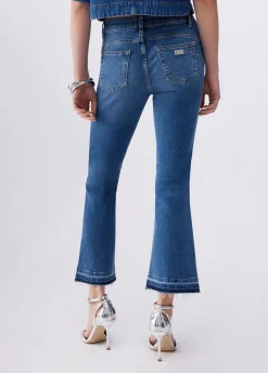 Jeans bootcut con orli unfinished