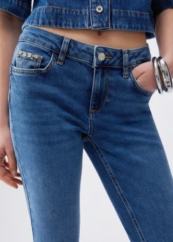 Jeans bootcut con orli unfinished