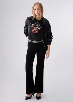 Jeans flare con bottoni gioiello