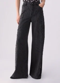 Jeans flare con castoni gioiello