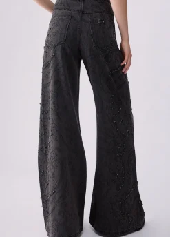 Jeans flare con castoni gioiello