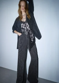 Jeans flare con castoni gioiello
