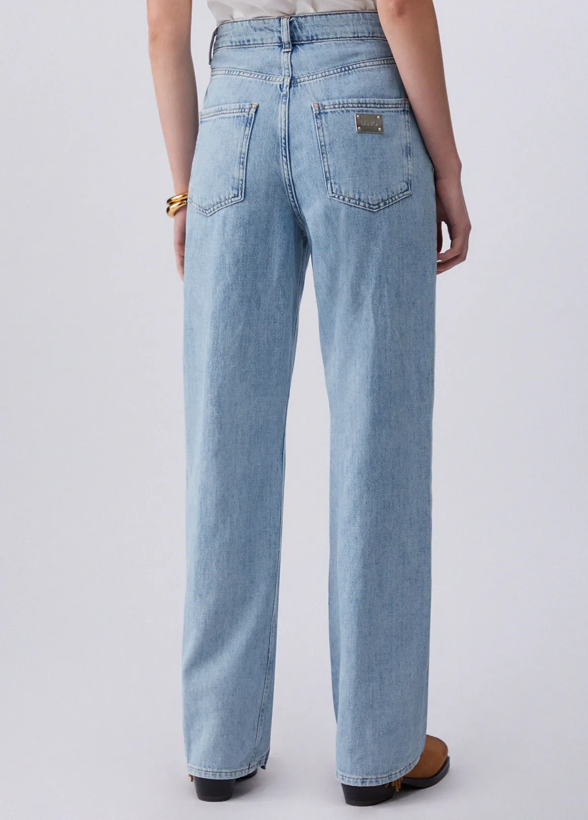 Jeans flare con intreccio