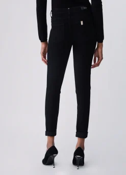 Jeans skinny con bottoni decorativi