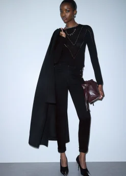 Jeans skinny con bottoni decorativi