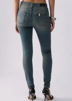 Jeans skinny con bottoni lavorati