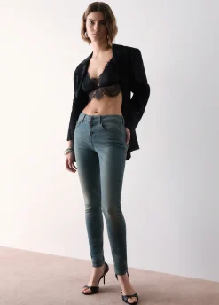Jeans skinny con bottoni lavorati