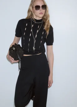 Lupetto con cut-out e perline