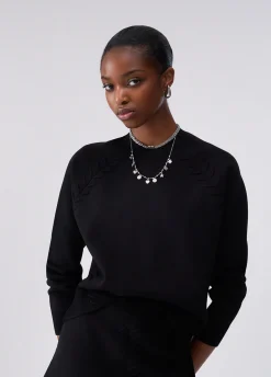 Maglia boxy con dettagli intrecciati