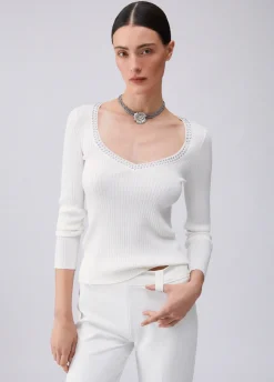 Maglia scollo a V con borchie
