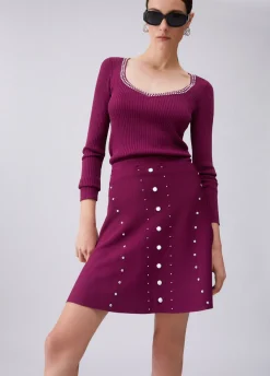 Maglia scollo a V con borchie