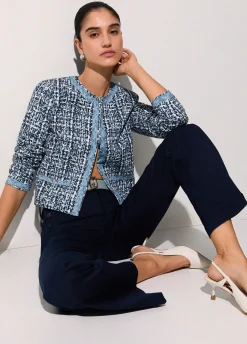 Pantaloni flare con bottoni logati