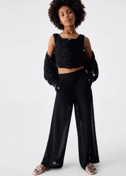 Pantaloni flare con bottoni logati