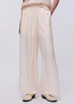 Pantaloni flare laminati