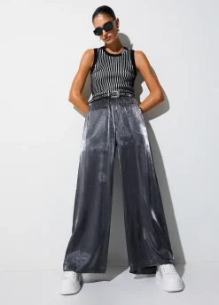 Pantaloni flare laminati