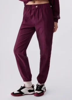 Pantaloni jogging con tape logato