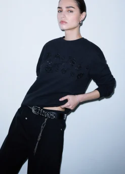 Pantaloni oversize con charm