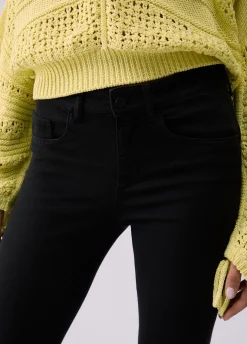 Pantaloni skinny a vita alta