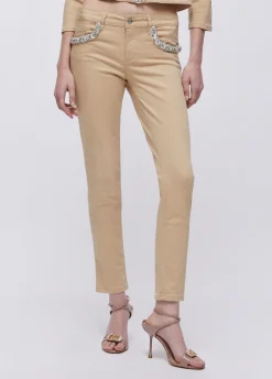 Pantaloni skinny con applicazioni gioiello