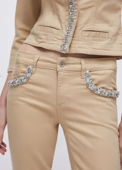 Pantaloni skinny con applicazioni gioiello