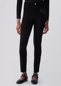Pantaloni skinny con ricamo gioiello
