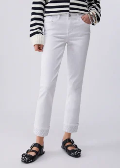 Pantaloni skinny con risvolto e strass