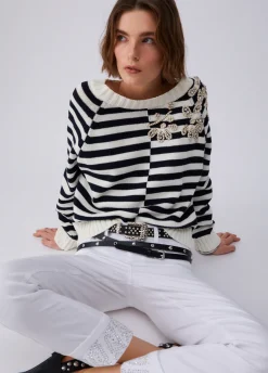 Pantaloni skinny con risvolto e strass