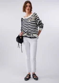 Pantaloni skinny con risvolto e strass
