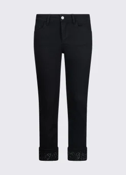 Pantaloni skinny con risvolto e strass