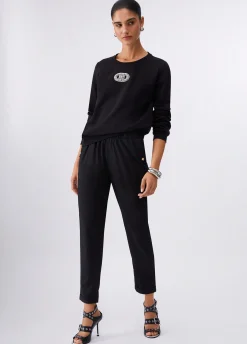 Pantaloni slim fit con risvolto