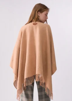 Poncho con logo embossed