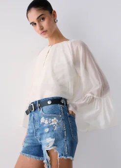 Short in denim con ricami gioiello