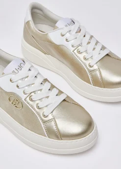 Sneakers in pelle laminata
