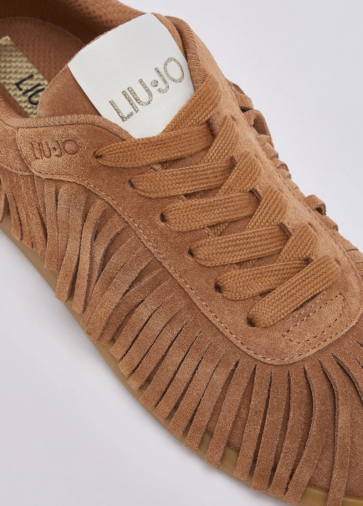 Sneakers in suede con frange