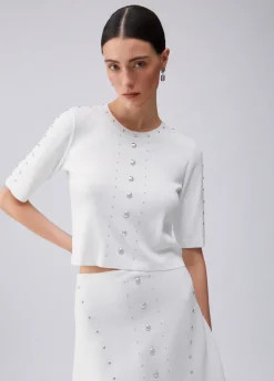 Top in maglia con borchie