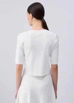 Top in maglia con borchie