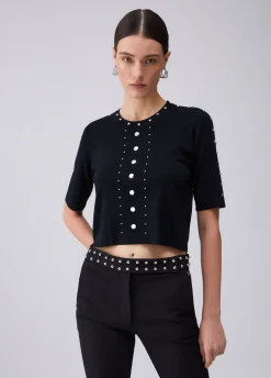 Top in maglia con borchie