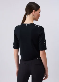 Top in maglia con borchie