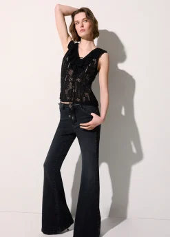 Top in pizzo con volant
