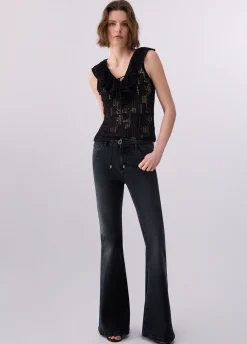 Top in pizzo con volant
