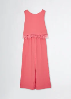 Tuta elegante con piume